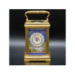 A good 19thC. French repeating carriage clock with Sevres style porcelain panel with figurative deco