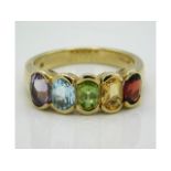 A 9ct gold ring set with amethyst, topaz, peridot, citrine & garnet, 4.1g, size O