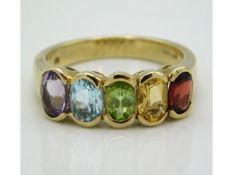 A 9ct gold ring set with amethyst, topaz, peridot, citrine & garnet, 4.1g, size O