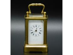 A 19thC. French miniature carriage clock stamped A B depose to rear, loose glass panel, crack to top