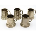 Five 1960s miniature white metal Indian gold trophy tankards with glass bottoms, four from Moran Pol