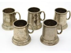 Five 1960s miniature white metal Indian gold trophy tankards with glass bottoms, four from Moran Pol
