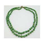 An art deco period 1920s jade double strand jade necklace, total length 32in, 54g