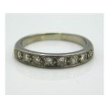 An 18ct white gold half eternity ring set with approx. 0.5ct diamonds, 3.5g, size N