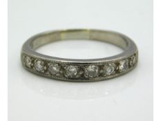 An 18ct white gold half eternity ring set with approx. 0.5ct diamonds, 3.5g, size N