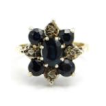 A 9ct gold ring set with diamond & five sapphires in floral arrangement, 4.4g, size M