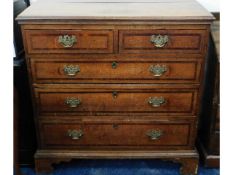 An early 19thC. Georgian oak chest of drawers, som