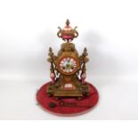 A 19thC. French gilt clock with Sevres style porce