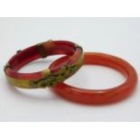 A Carnelian bangle with dragon & phoenix decor twi