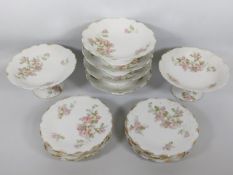 An antique porcelain Limoges dessert service with
