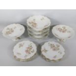 An antique porcelain Limoges dessert service with