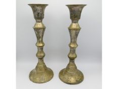 A pair of large silver plate on brass candleholder