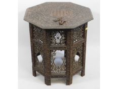 An Anglo-Indian carved octagonal table, some fault