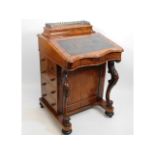 A mid Victorian walnut Davenport desk, 33.375in hi