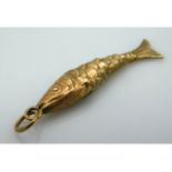 A yellow metal articulated fish pendant/charm, tes