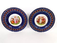 A pair of continental porcelain ribbon plates with