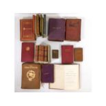 A quantity of mixed books, many in soft leather covers including poetry, Operas of Wagner, Shakespea