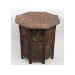 An Anglo-Indian carved octagonal folding table, 23