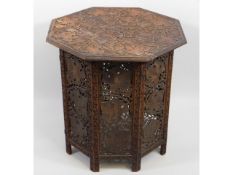 An Anglo-Indian carved octagonal folding table, 23