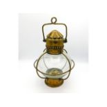An early 20thC. globular hanging lamp with brass f