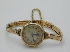 A ladies 9ct gold wristwatch & strap, running orde