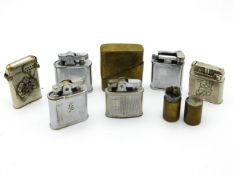A small collection of vintage lighters including o