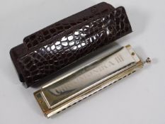 A cased Hohner Chromonica III 280 harmonica, C Key