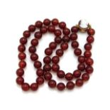 A carnelian necklace, set with a 9ct gold clasp, 2