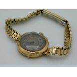 A ladies 9ct gold cased watch, strap plated