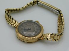 A ladies 9ct gold cased watch, strap plated