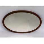 An antique oval mirror, 33in x 22in