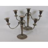 A pair of silver plated candelabra, 11in tall