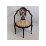 A Regency style antique armchair, repairs to under