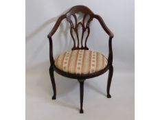 A Regency style antique armchair, repairs to under