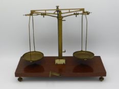 A set of mounted brass balance scales by H. L. Bec