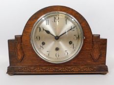 An oak Westminster chime mantle clock by Haller, 1