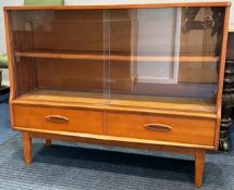 A teak G-Plan style retro bookcase with glass sliding doors & drawers