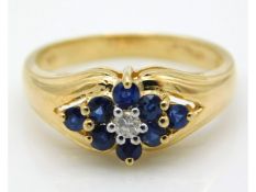 A 14ct gold diamond & sapphire ring, size M/N, 3.7