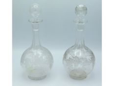 A pair of 19thC. wheel etched glass decanters, 10.