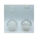 A pair of 19thC. wheel etched glass decanters, 10.