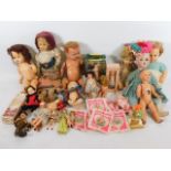 A quantity of mixed dolls & other items, some a/f