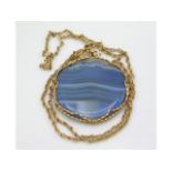 A yellow metal chain & mount set with blue agate p