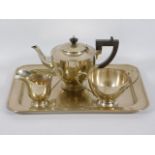 A three piece silver plated tea set with silver pl
