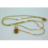 A 14ct gold necklace with rose pendant, 17in long,