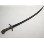 A 19thC. curved sword with detailed brass lion hea