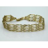 A 9ct gold five bar gate bracelet, 6.75in long, la