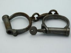 A pair of Victorian Hiatt Best handcuffs with key