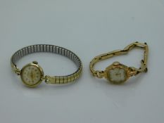 A ladies 9ct gold cased wristwatch with plated str