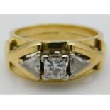 An avant-garde styled 18ct gold ring set with 15pt