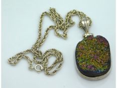 A silver mounted titanium druzy pendant 63mm drop